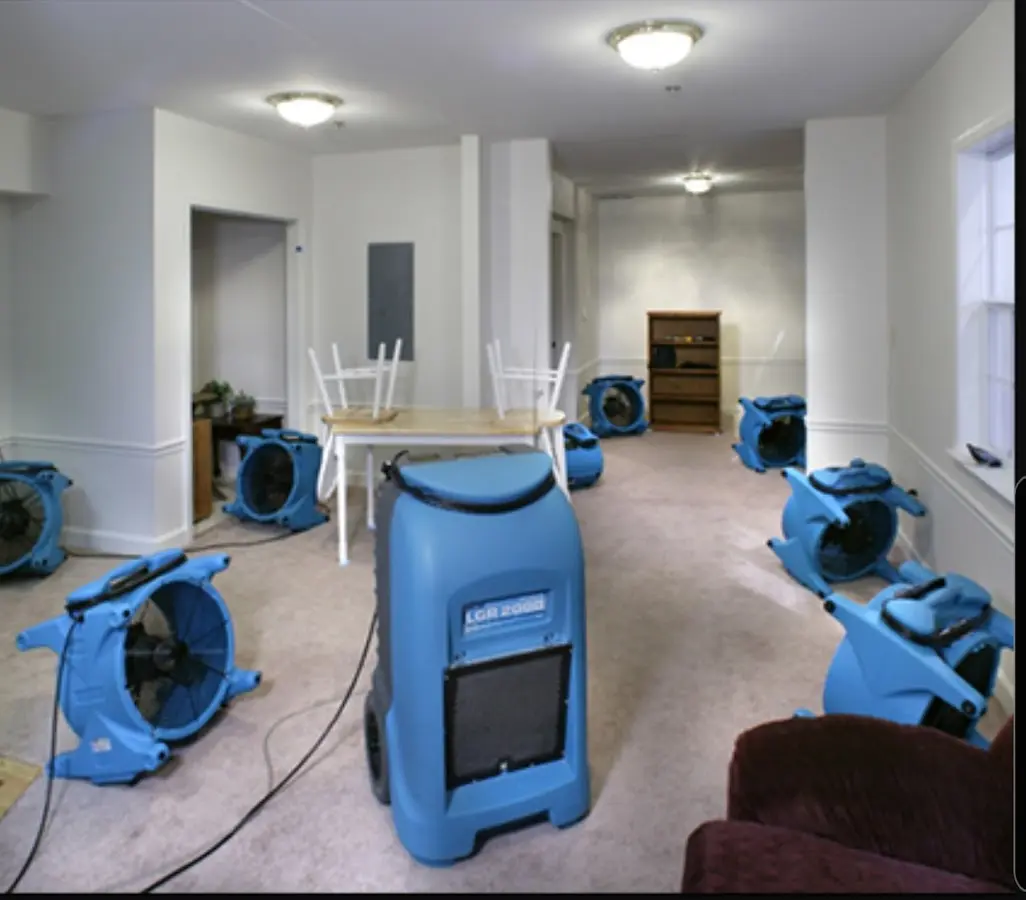 Air movers and dehumidifier setup for Water Damage Restoration in Brewer